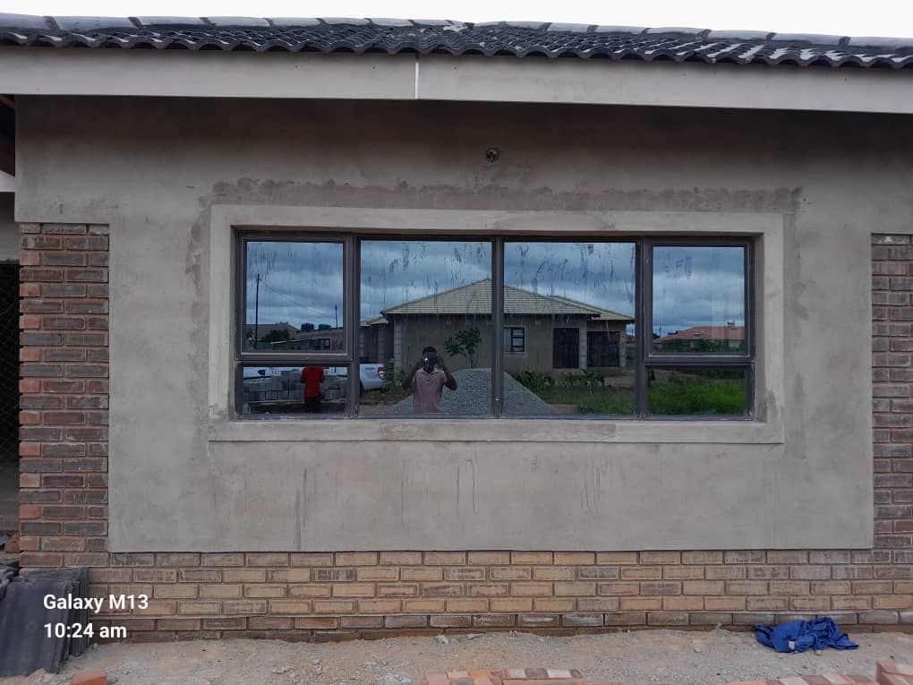 Modern glass windows installation with stainless steel fittings